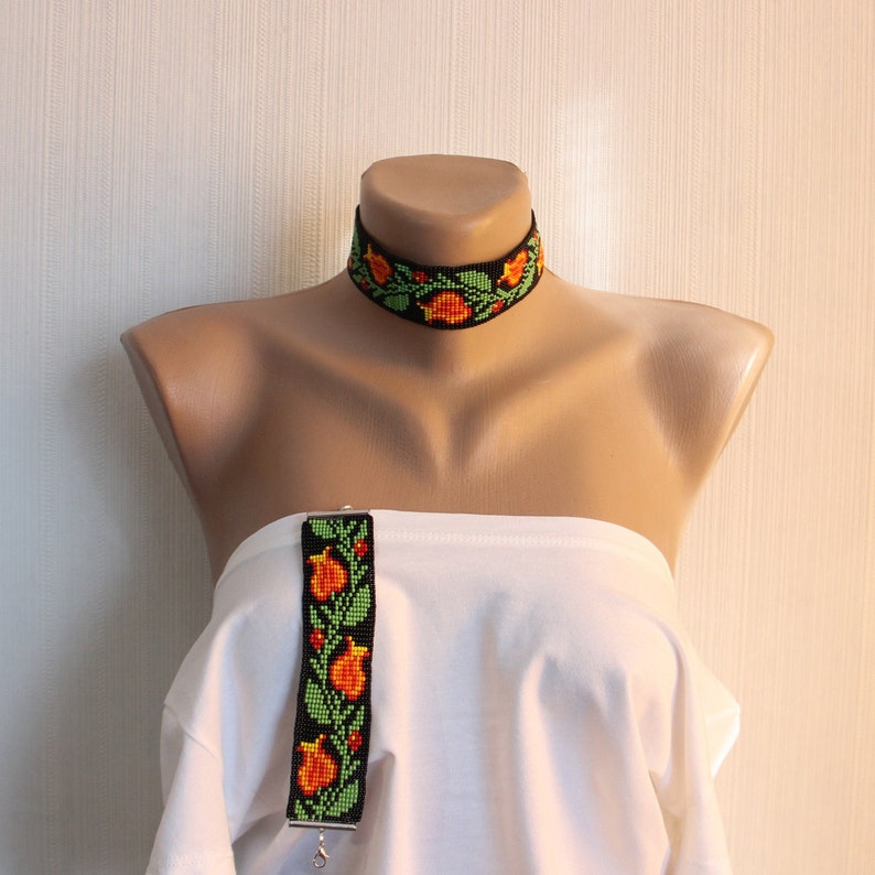 Wide beaded choker with a traditional Slavic pattern Orange flowers ethnic amulets Black background boho jewelry