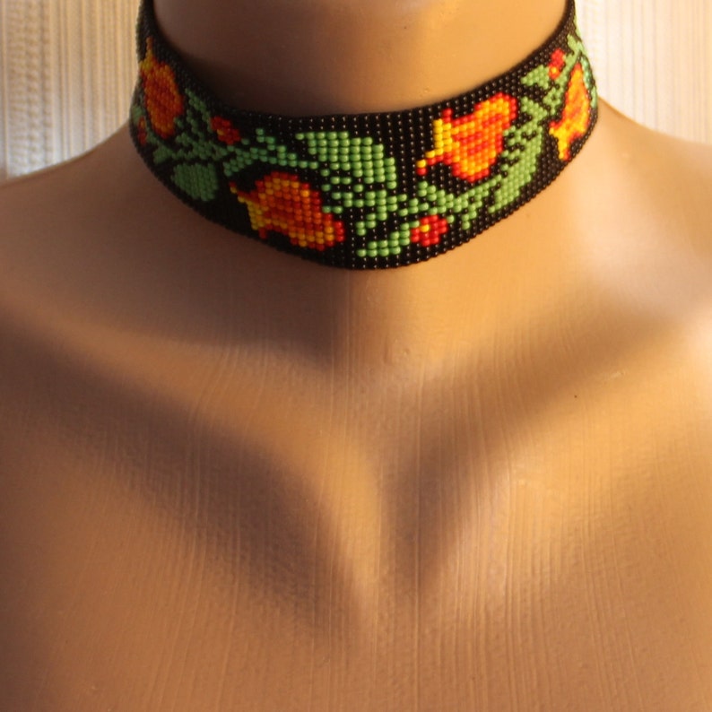 Wide beaded choker with a traditional Slavic pattern Orange flowers ethnic amulets Black background boho jewelry