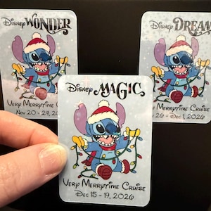 May include: Three rectangular magnets featuring the character Stitch wearing a Santa hat and scarf, tangled in colorful Christmas lights. The text reads Disney Wonder, Disney Dream, and Disney Magic, with Very Merrytime Cruise and dates.