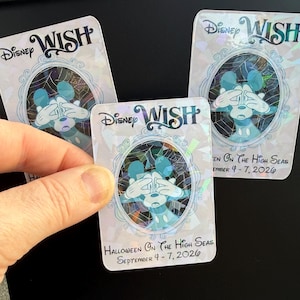 May include: Three holographic Disney Wish cards. Each card features a cartoon Mickey Mouse character with his eyes covered. The cards have the text "Disney Wish" and "Halloween On The High Seas September 4-7, 2026".
