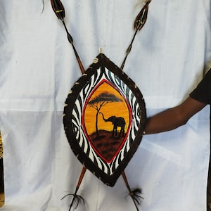 Defend & Adorn: Maasai Spear Bundle (2 Spears and Elephant Shield) 2 maasai Spears and kenya flag shield Easy to dismantle easy carry Brown
