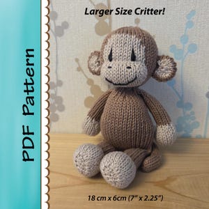 May include: Knitted brown monkey toy with a smiling face. The monkey is 18 cm tall and 6 cm wide.  Larger Size Critter! PDF Pattern.