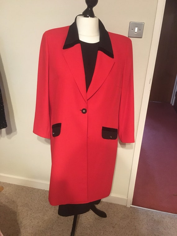 black dress with red coat