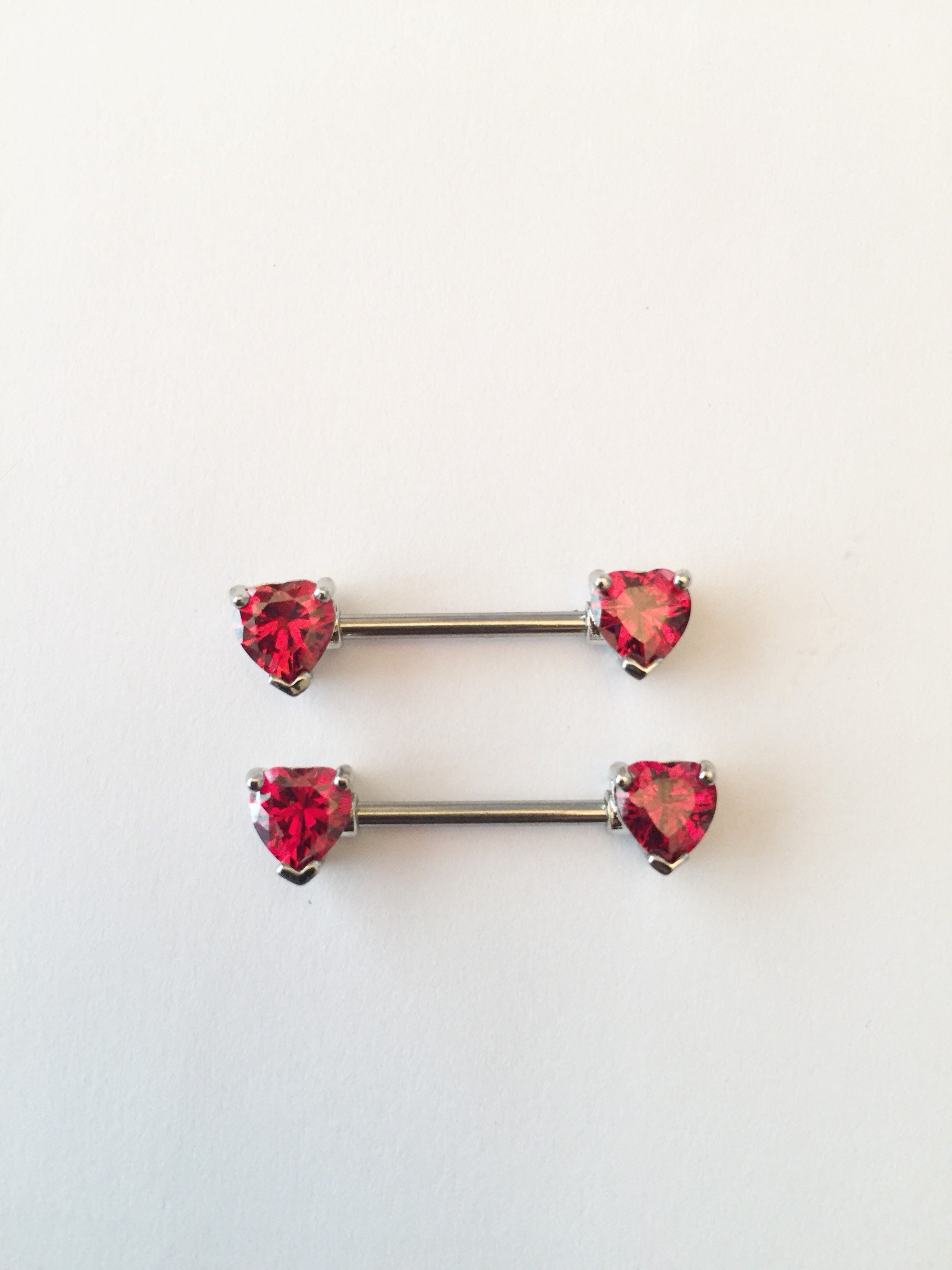 Red heart nipple piercing deals