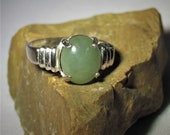 Jade. Jadeite. Creamy Green Jade From China. Near Perfect Color. Large Jade Gem, 11 x 9mm, 3.66 ct, set in sterling silver ring, size 7.