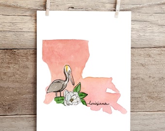 May include: A watercolor painting of the state of Louisiana with a pelican and a magnolia flower. The state is painted in shades of pink and the pelican is gray with a yellow beak. The magnolia flower is white with green leaves.