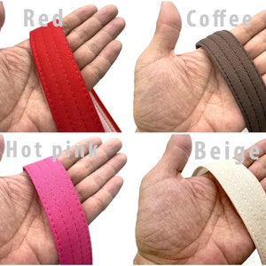 May include: Close-up of four different colored tote bag handles. The handles are made of a thick, woven fabric and have a stitched seam down the center. The colors are red, coffee, hot pink, and beige.