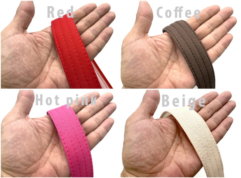 May include: Close-up of four different colored tote bag handles. The handles are made of a thick, woven fabric and have a stitched seam down the center. The colors are red, coffee, hot pink, and beige.