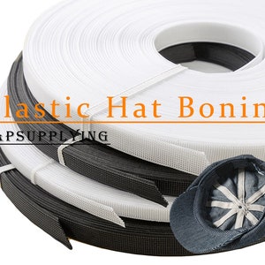 May include: White and black plastic hat boning, also known as hat stiffener, in rolls. The boning is used to shape and support the crown of hats. The image also shows a blue baseball cap with a white mesh panel.