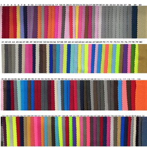 May include: A color swatch chart featuring a wide array of fabric samples. The samples are arranged in vertical columns, showcasing a spectrum of hues from vibrant reds and oranges to cool blues and greens. Each color is numbered for easy reference.