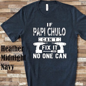 May include: A dark blue t-shirt with white text that reads "If Papi Chulo Can't Fix It No One Can". The text is surrounded by images of a screwdriver and a drill.