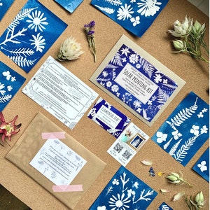 May include: A blue and white solar printing kit with instructions, a brown envelope, and a variety of blue and white prints. The kit includes everything you need to create your own unique botanical prints.