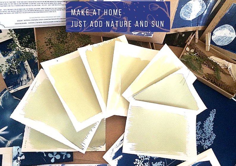 May include: A close-up of seven cyanotype prints, each with a different shade of blue, arranged in a fan shape. The prints are on white paper with a white border. The text "MAKE AT HOME JUST ADD NATURE AND SUN" is visible in the top centre of the image.