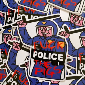 May include: A sticker featuring a cartoon pig wearing a police uniform and holding a baton. The pig is holding a sign that says "F**k Police The Pigs". The sticker is printed on white paper and has a blue and red color scheme.