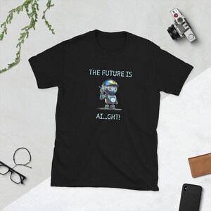 May include: Black t-shirt with a cartoon robot and the text "THE FUTURE IS AI...GHT!"