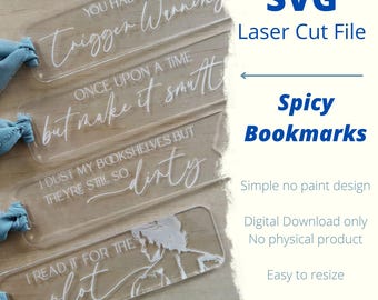 May include: Clear acrylic bookmarks with white engraved text, including phrases like "Trigger Warning" and "I read it for the plot." The image also includes the text "Spicy Bookmarks" and "SVG Laser Cut File."