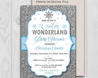 May include: A silver glitter baby shower invitation with a blue ribbon and snowflakes. The invitation reads "Join us for a Winter Wonderland Baby Shower Honoring Christina Smith" and includes the date, time, and location of the event. RSVP information is also included.
