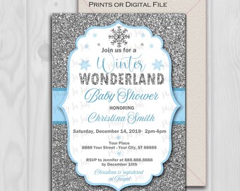 May include: A silver glitter baby shower invitation with a blue ribbon and snowflakes. The invitation says "Join us for a Winter Wonderland Baby Shower Honoring Christina Smith" and includes the date, time, and location. It also says "Christina is registered at Target".