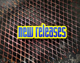 Letrero de estrenos de Blockbuster – Decoración para estantería de cinéfilos