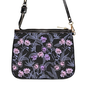 Pastel goth purse, Small vegan leather gothic floral shoulder bag w/ purple pink & black skull flower print. Spooky tiki fashion accessory