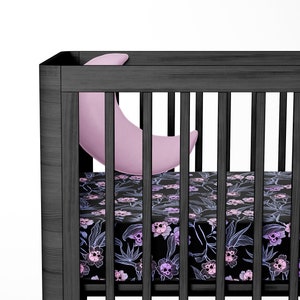 Pastel Goth Crib Sheets, Spooky skull flower infant cot sheets in pink purple & black, a beautiful macabre baby shower gift for gothic mom