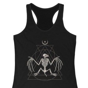 May include: Black tank top with a graphic of a bat skeleton inside a geometric design with a crescent moon and star above it.