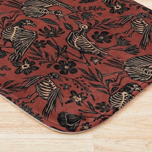 Fall Skeleton Bath Mat, Macabre linocut botanical folk art shower decor w/ floral birds skulls in bold rust orange & black for goth bathroom