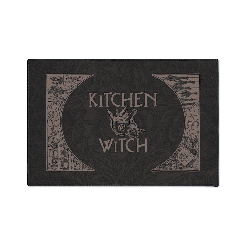 May include: Black and white kitchen witch themed design featuring a mortar and pestle, herbs, and a bottle. The text "Kitchen Witch" is in a decorative font.