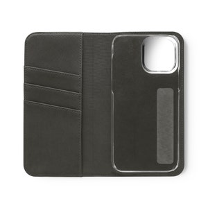 May include: A black leather phone case with a clear plastic window for the phone screen. The case has a flap that folds over the phone and has three card slots on the inside.