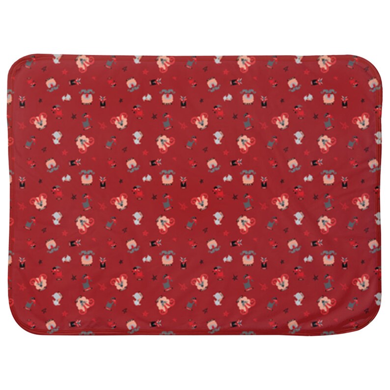 May include: Red fleece baby blanket with a repeating pattern of white sheep wearing red and white hats and holding red and white candy canes.