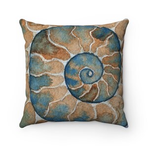 May include: A square throw pillow with a watercolor design of a nautilus shell in shades of blue, brown, and beige.