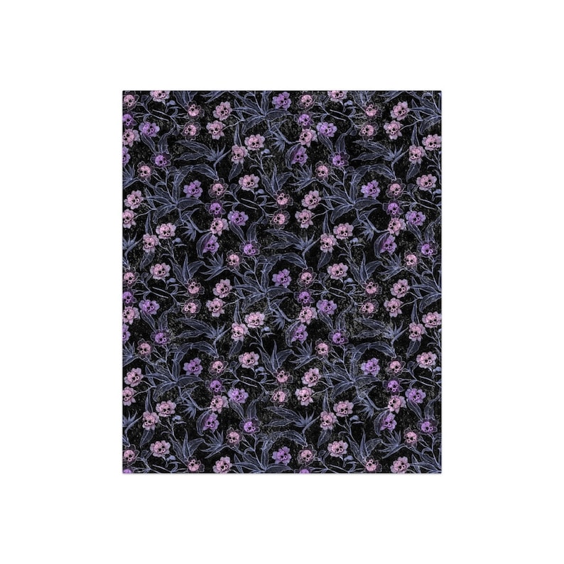 Pastel goth blanket made of crushed velvet showing the entire blanket. Blanket has pink, purple and blue skull flowers.