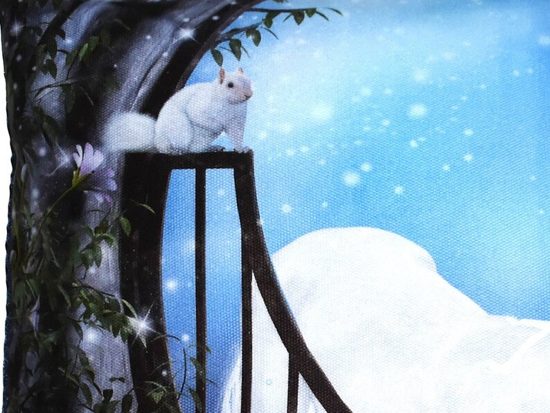 May include: A white squirrel sits on a black railing with a blue and white background. The background has a snowy, wintery feel with white snowflakes on a light blue sky.