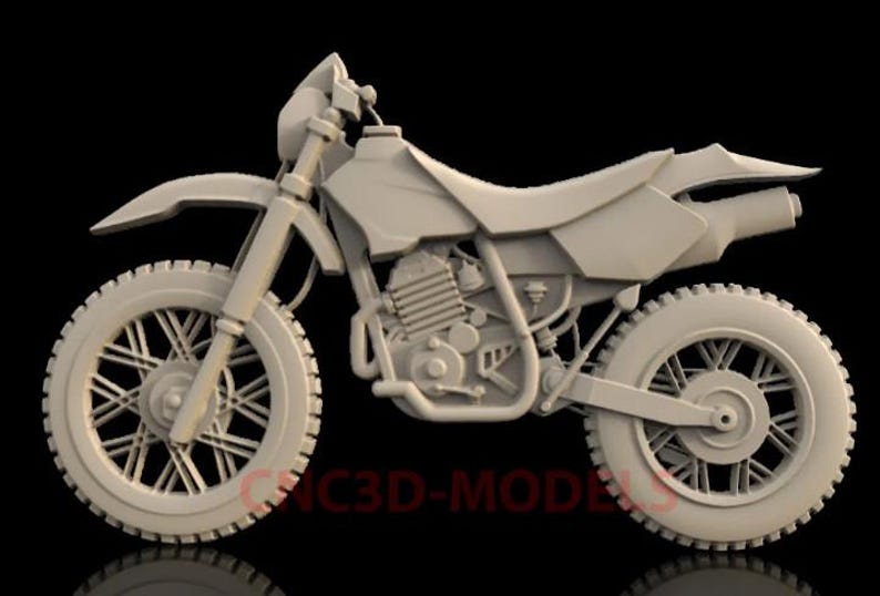 May include: A gray 3D model of a dirt bike with a detailed engine and spoked wheels.