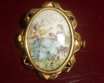 Broche vintage ,broche métal doré et limoges décor P PASTAUD