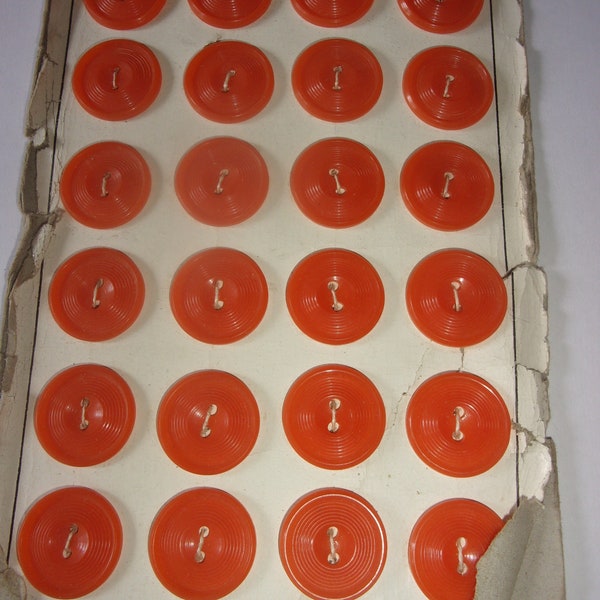 Card of 24 orange buttons, 24 vintage buttons