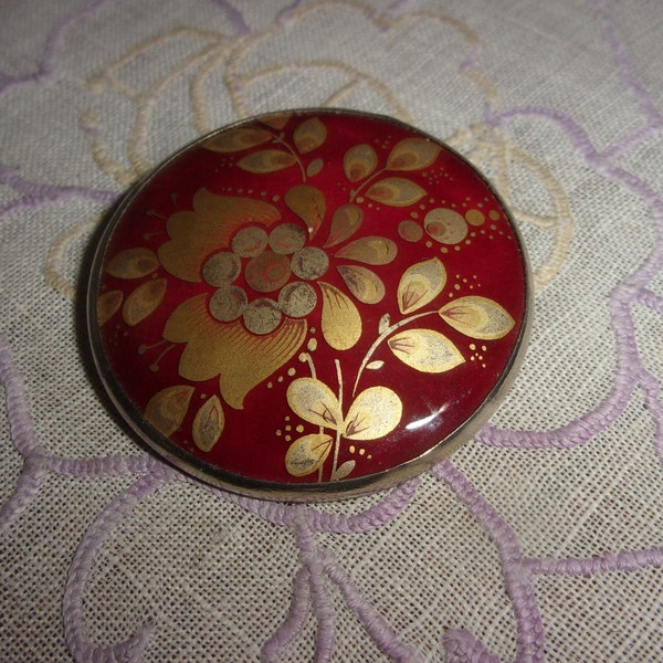 Broche Pendentif vintage motif floral dorée  ,fond bordeaux   Michel Le Brun Paris