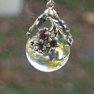 rock crystal quartz pendant necklace  pools of light with ruby floral cap sterling chain