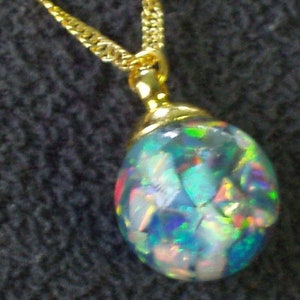 large floating opal necklace pendant  glass globe opals float like a snow globe  gold filled chain