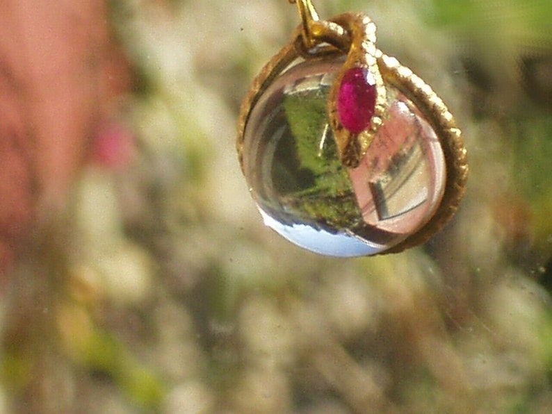 rock crystal ruby snake pendant necklace pools of light snake wrapped