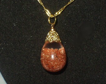floating gold stone  gold filled chain  necklace pendant  floating in a glass drop  like a snow globe