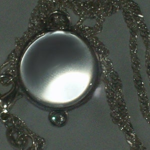 pools of light rock crystal quartz pendant diamond accent sterling silver bezel