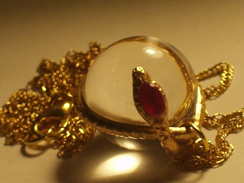 rock crystal ruby snake pendant necklace pools of light snake wrapped