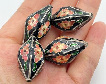 May include: Four black and silver beads with pink and orange floral designs. The beads are hand-painted with intricate details and have a glossy finish.