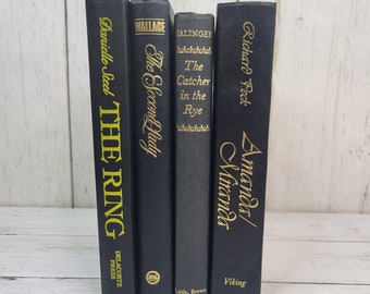 Black decorative books, bookstack for staging, decor, props, office. Black and gold sleek coffee table books