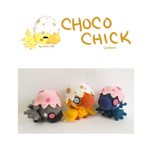 May include: Three crocheted plushies in the shape of chicks. The chick on the left is gray with pink accents, the middle chick is yellow with a white eggshell on its head, and the chick on the right is blue with pink accents. The plushies are all sitting on a white surface. The image also includes a logo for "Choco Chick" with a cartoon chick hatching from an egg.