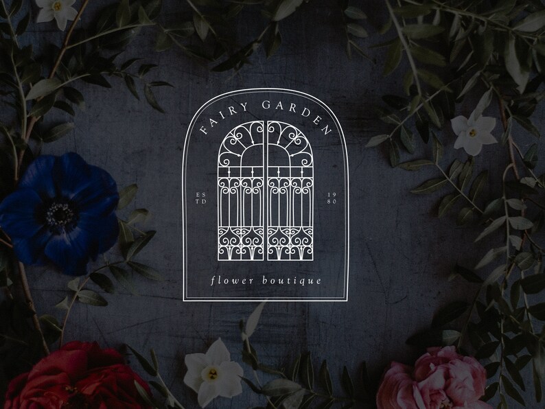 May include: A white logo on a dark gray background with a floral border. The logo features a stylized iron gate with the text "Fairy Garden flower boutique" and "Est. 1980".