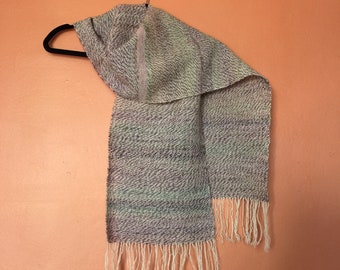 Handspun woven scarf in Devon Closewool and fine Shetland lambswool. Cream, dyed pink lilac. 180 x 27cm & hand knotted fringe.