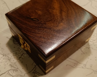 Wooden box with brass inlay for compass