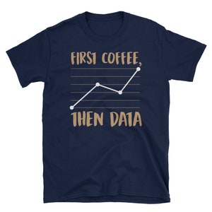 May include: Navy blue t-shirt with a brown graphic of a line chart and the text "FIRST COFFEE, THEN DATA".